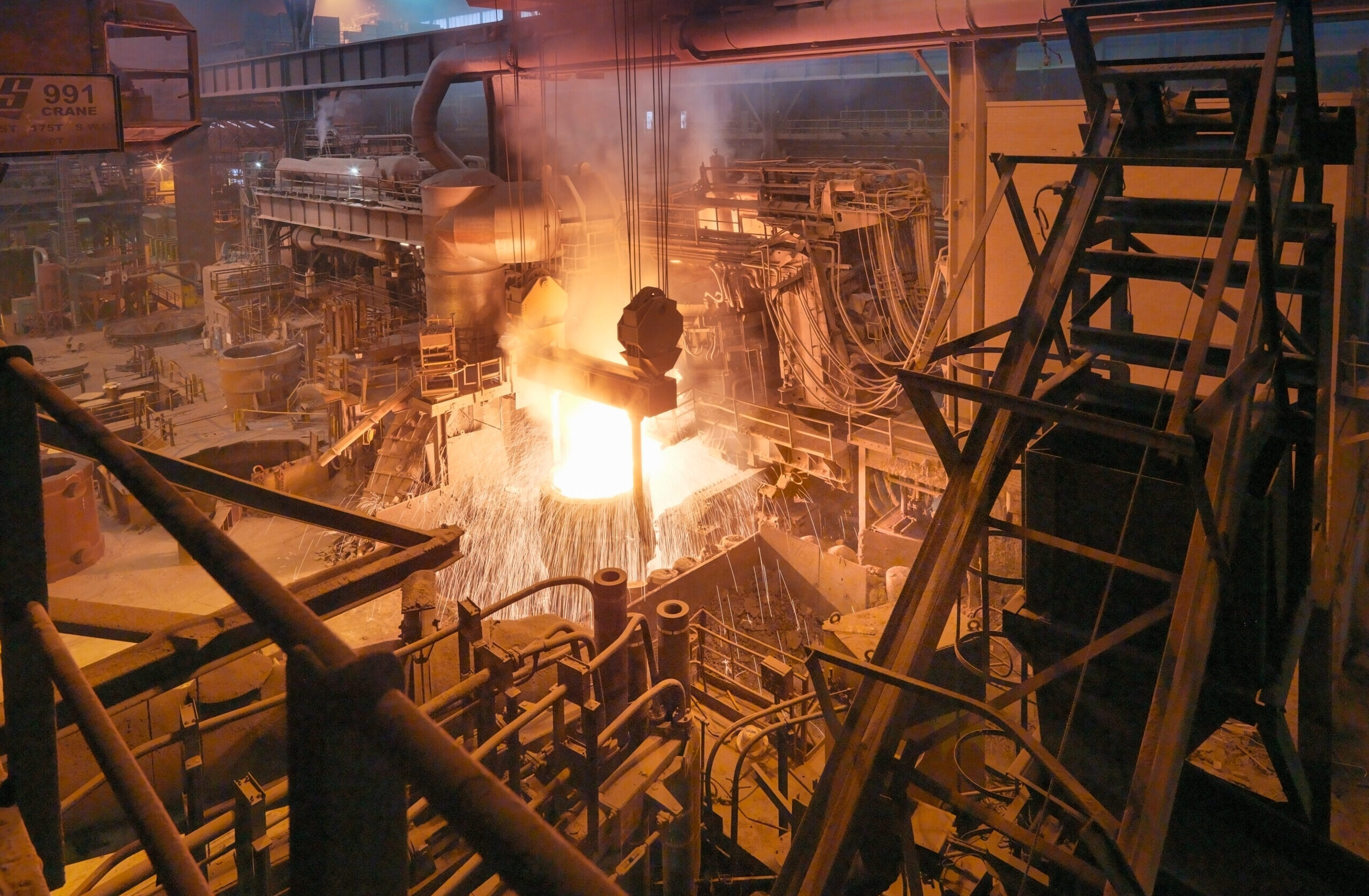 molten-steel-being-poured-in-steelworks-2022-01-25-05-02-09-utc